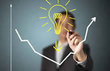 Male person drawing a bulb that stands for the idea and creativity